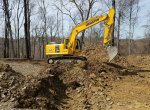 Excavator performing land clearing - 3 Brothers Excavating