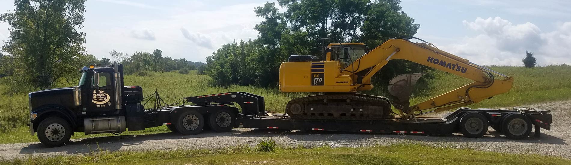 Large excavator on a flat bed trailer